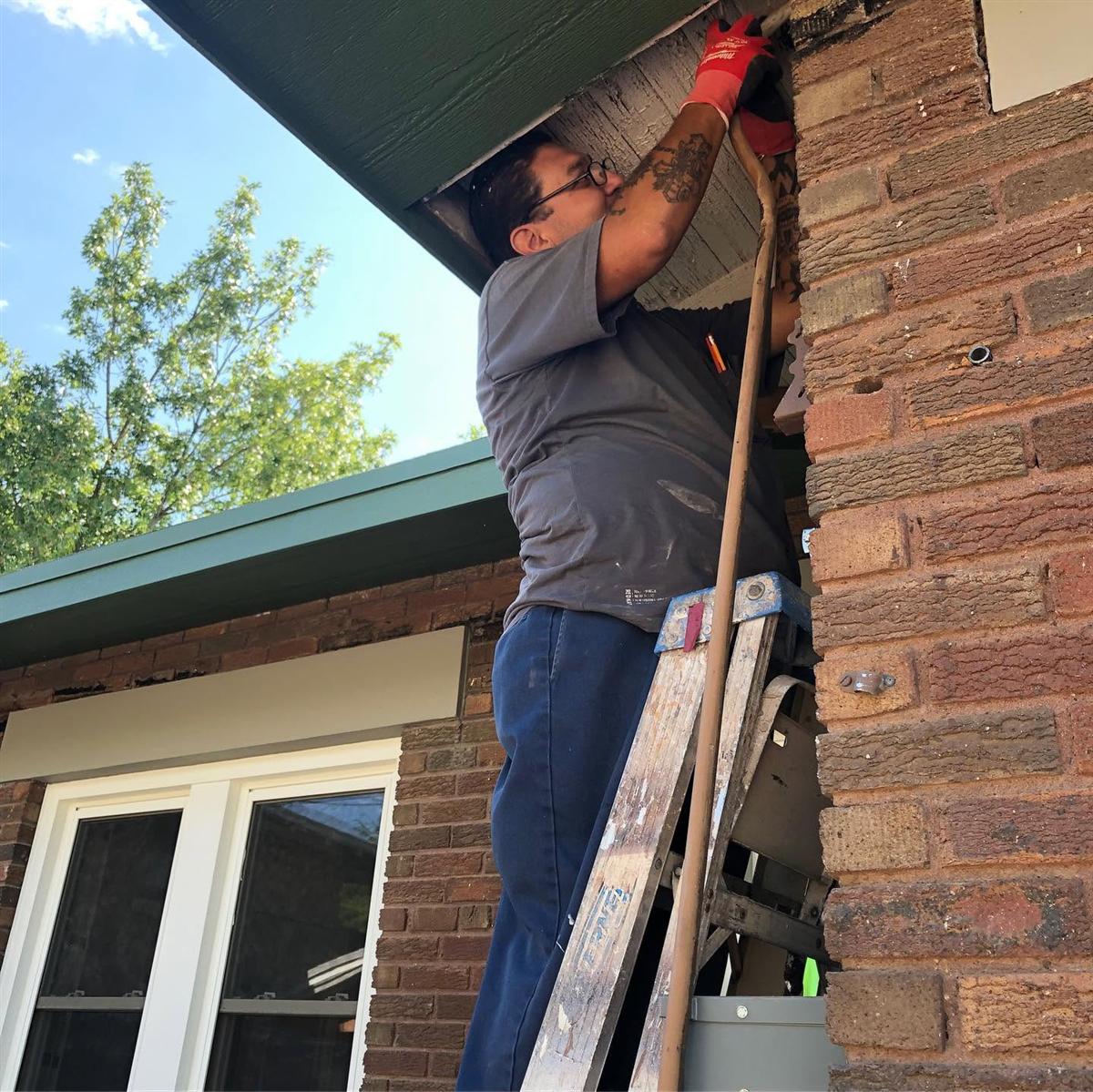 Tovar Electric technician working on outside wiring